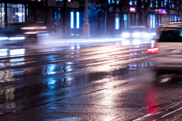 istock cars in blurred motion at night with switched on headlights 853215234
