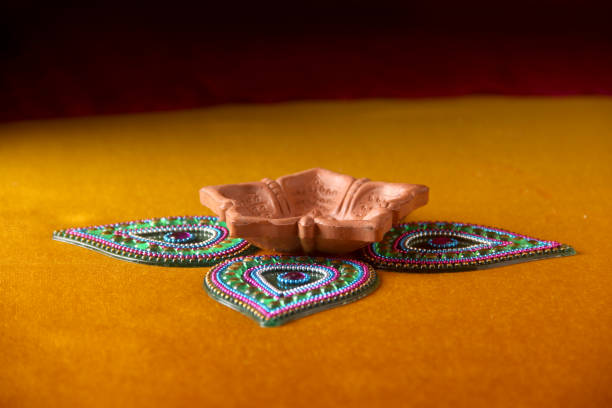 istock Rangoli design around Diwali lamp 853225636