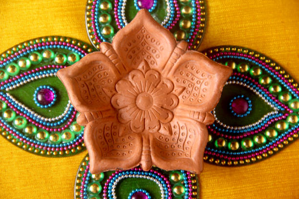 istock Rangoli design around Diwali lamp 853225732