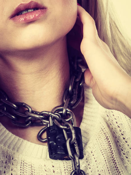 istock Woman having metal chain around neck 853227040