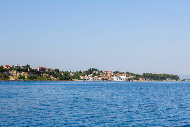 istock Town over sea, Island across seashore 853238466