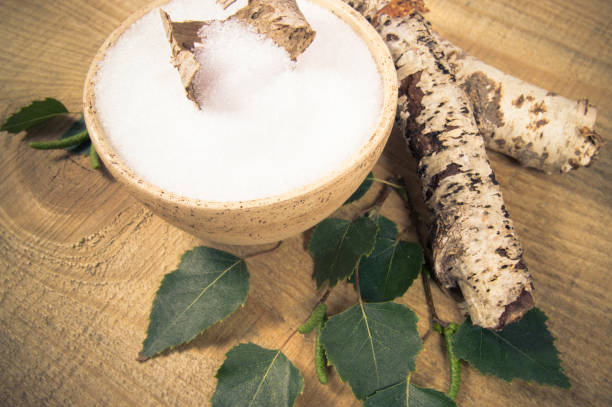 istock Xylitol - sugar substitute. Birch sugar on wooden background. 853242916