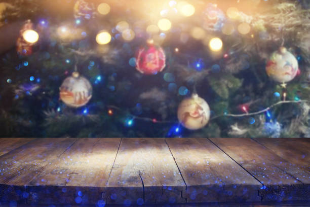 istock Empty table in front of christmas tree with decorations background. For product display montage 853252348