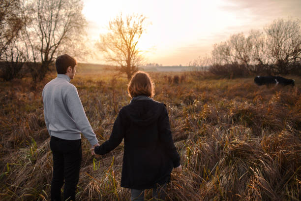 istock Heterosexual couple walking on the field 853264556