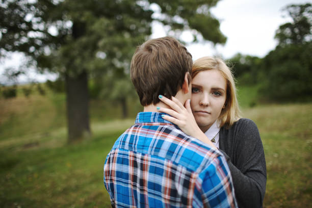istock Heterosexual couple walking on the field in summer 853265140