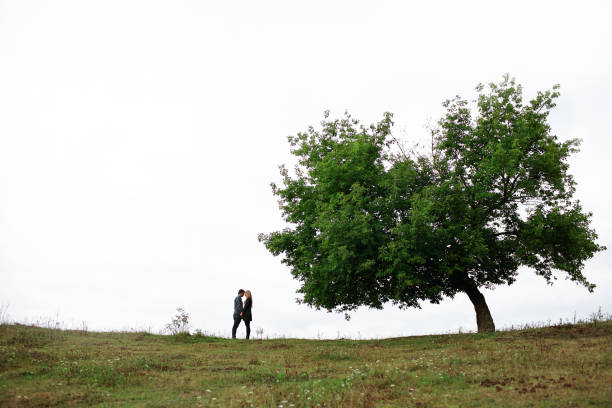 istock Heterosexual couple walking on the field in summer 853265210