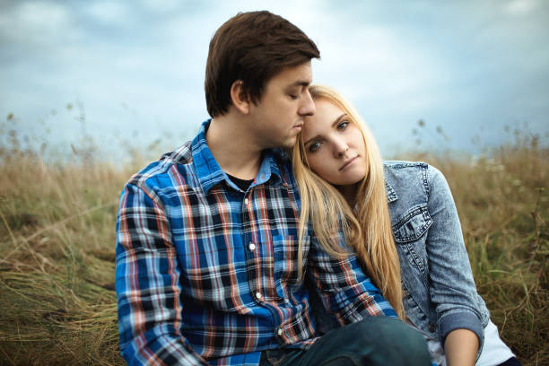 istock Heterosexual couple walking on the field in summer 853265226