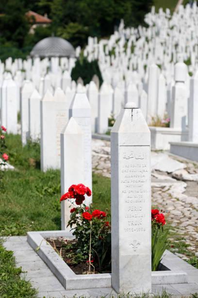 Martyr's Memorial Cemetery Kovaci In Sarajevo Cemetery For Muslims Killed During The Conflict In The Early 1990's In Sarajevo, Bosnia and Hercegovina. The Tombstones Are Facing The Opposite Direction So No Names Can Be Seen, There Are Thousands Of Markers Just Like This In The Cemetery. ethnic cleansing stock pictures, royalty-free photos & images