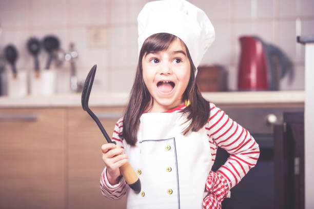 istock Little girl in the kitchen 853277404