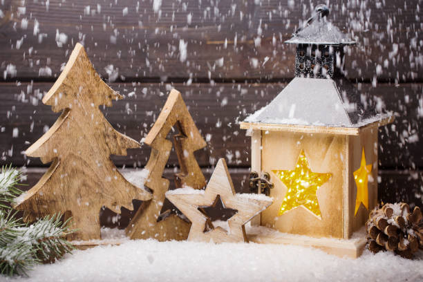 istock Burning lantern and christmas decoration in the evening. 853278334
