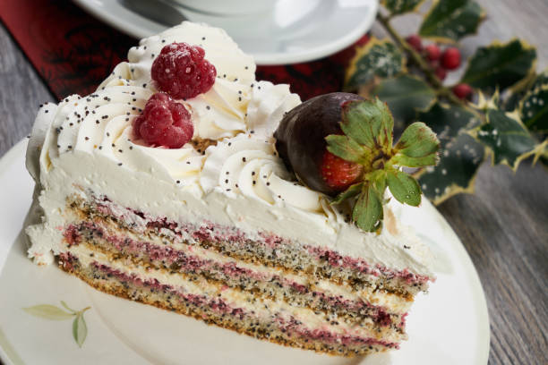 istock Sliced white Christmas cake with whipped cream 853324858