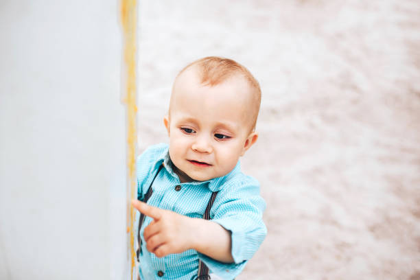 istock Cute little boy playing outdoor in the park 853328406