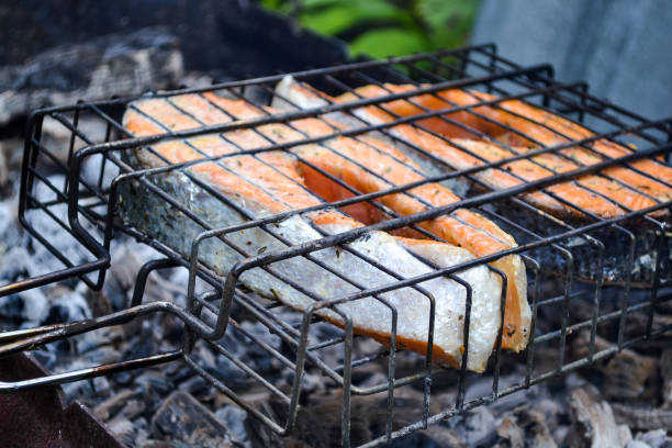 istock Grilled salmon steak. Grate, coals, smoke 853330344