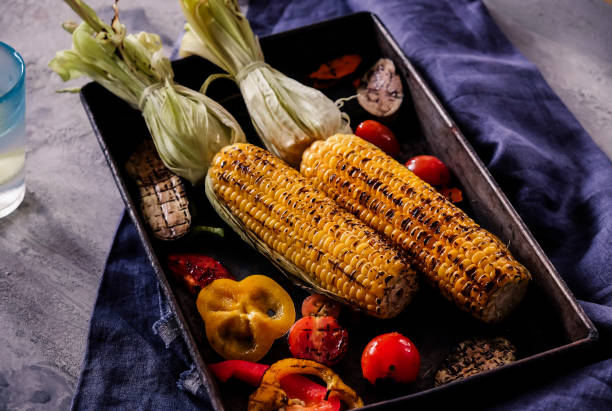 istock Homemade organic grilled summer vegetables on rustic table. Corn, pepper, onion, eggplant, zucchini. Vegetarian food concept 853330390