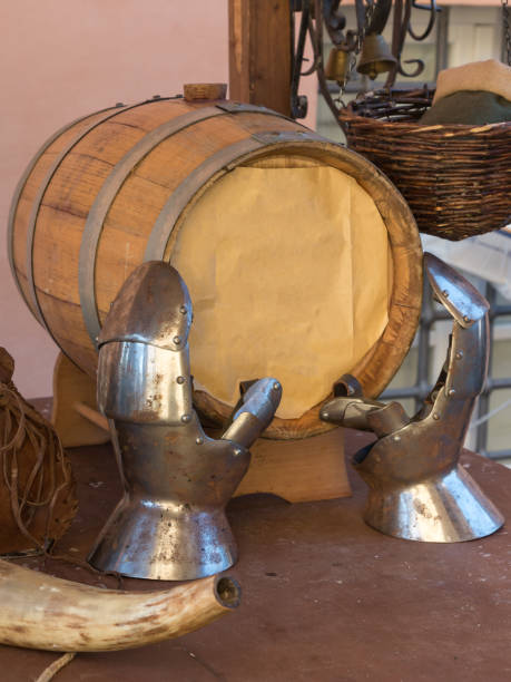 istock Oak Barrel on Wooden Table with Hand Iron Armors 853330580