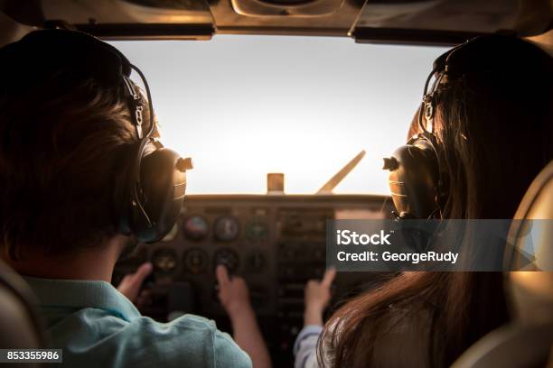 Couple In Aircraft Stock Photo - Download Image Now - Instructor, Flying, Pilot