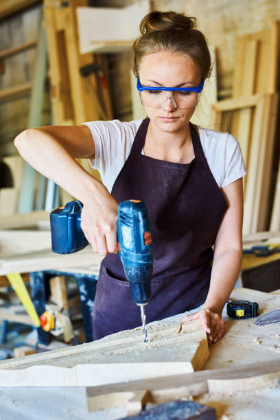 istock Female Carpenter Working in Shop 853360458