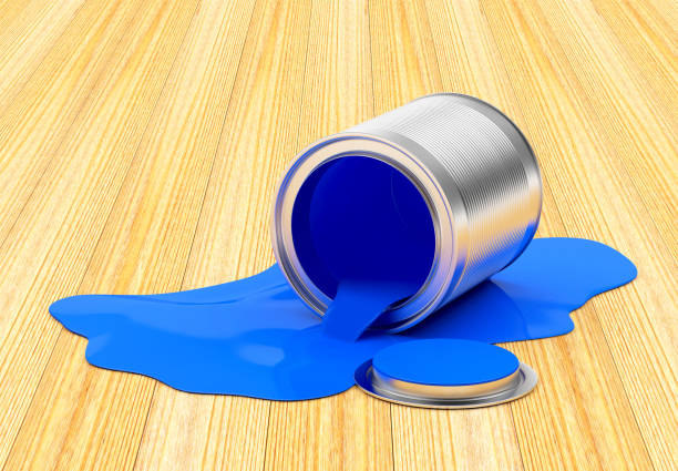 istock Open can with spilled blue paint on the wooden floor 853365162