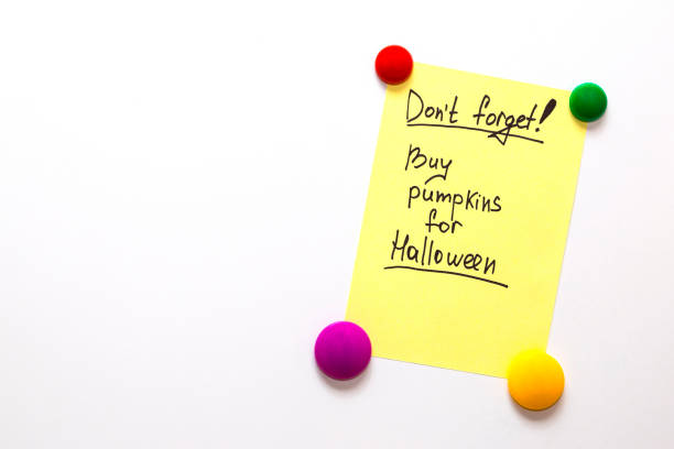 istock Fridge note with the text: Don't forget! Buy pumpkins for Halloween 853365962