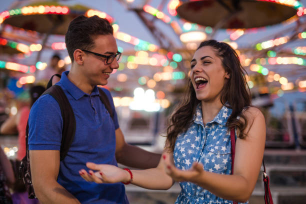 istock Happy couple at amusement park 853374796