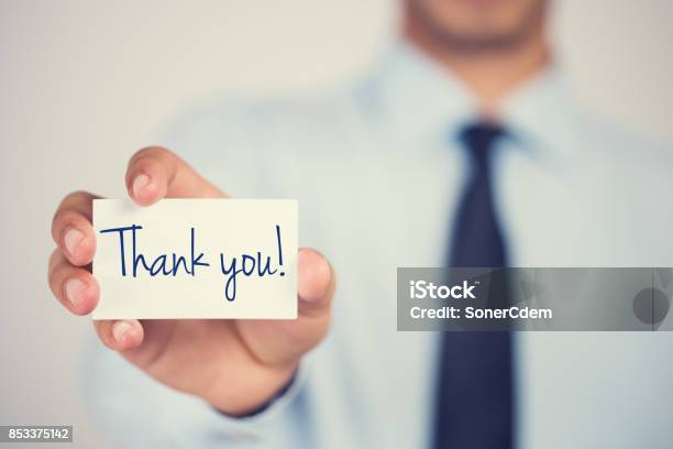 Thank You Word On Card Hold By Man Stock Photo - Download Image Now - Thank You - Phrase, Business, Gratitude