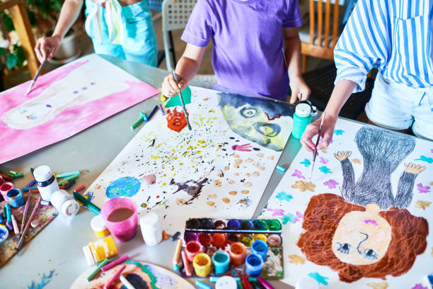 Hands of Children Painting in Art Class