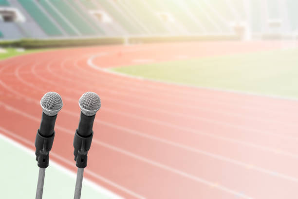 istock sports commentator with running field stadium background with space for text 853381250