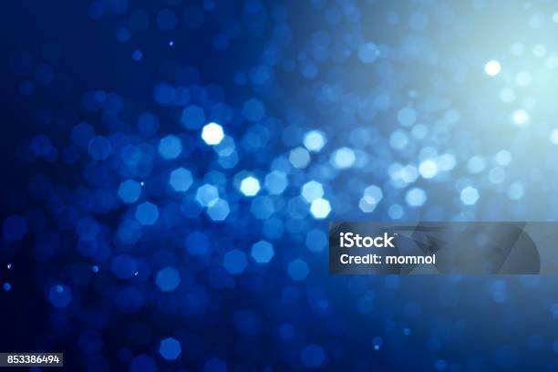 Abstract Bokeh Blue Backlight Background Stock Photo - Download Image Now - Backgrounds, Blue, Glittering