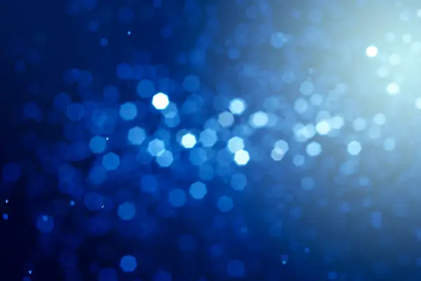 Photo of Abstract  bokeh blue backlight background.