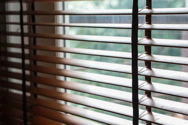 istock wood blind shade curtain and shadow 853387358