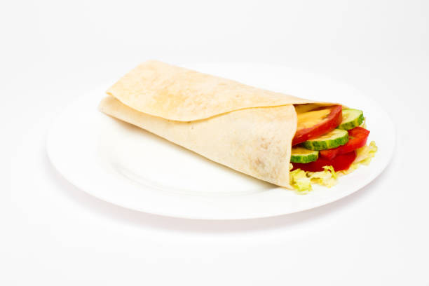 istock Burrito with grilled chicken and vegetables isolated on white background 853391296