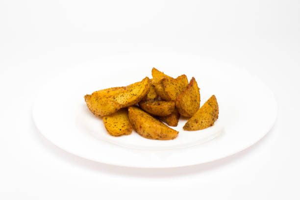 istock French fries in white plate isolated on white background 853391480