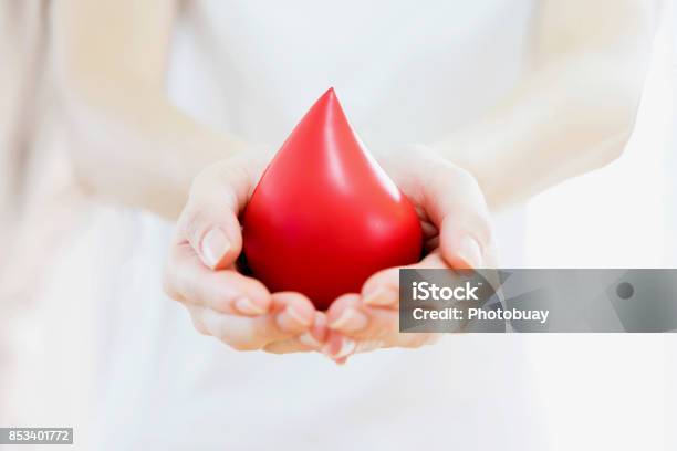 Hands Holding A Red Blood Stock Photo - Download Image Now - Blood, Adult, Adults Only