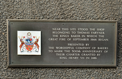 Memorial plaque showing information of the great fire of London in 1666.  The fire was started in a Bakery shop by The Kings Baker, in Pudding Lane, London, UK - 2017