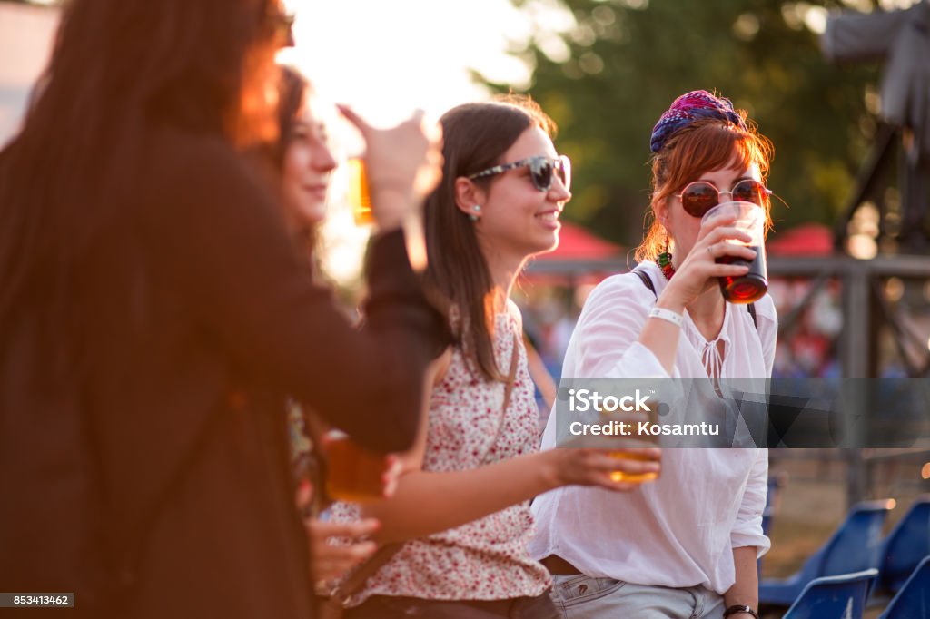 Tasting Beer In Beer Festival Group Of Charming And Cheerful Young Women Tasting Beer At Summer Festival Drinking Stock Photo