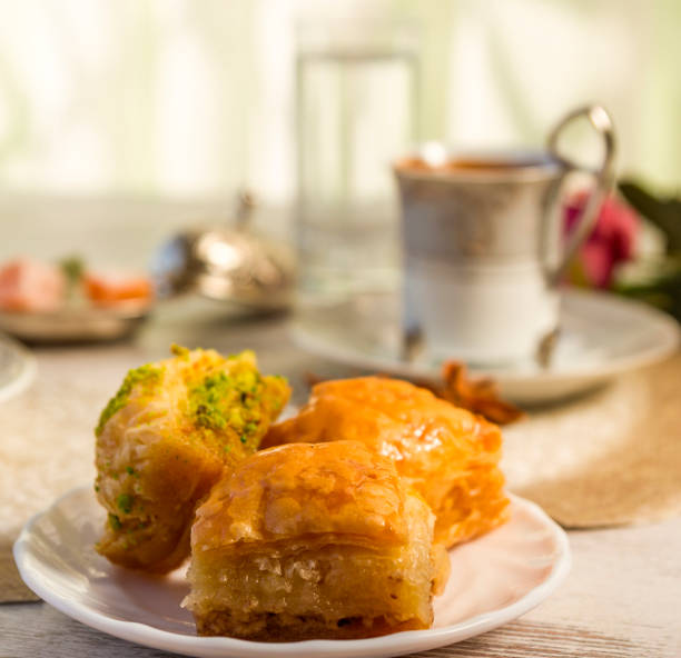 istock Cup of Turkish coffee and a plate with baklava 853423436