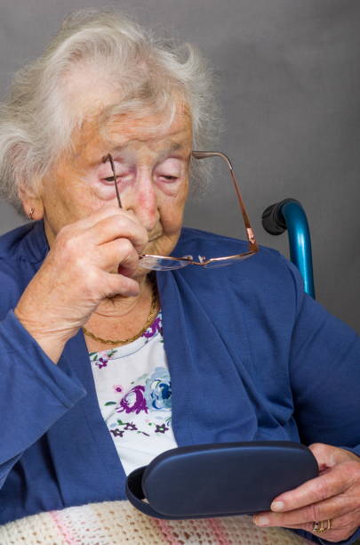 istock Senior Citizen putting Glasses on 853431338