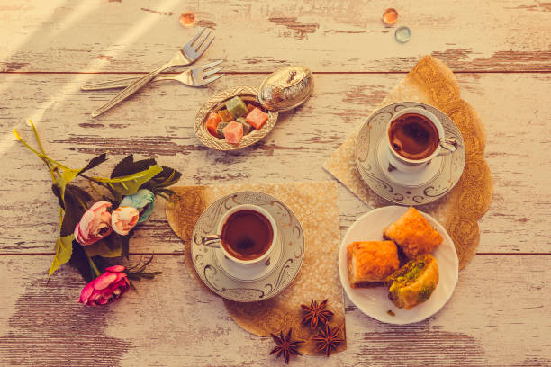 istock Two cups of Turkish coffee and plate with baklava top view 853434124