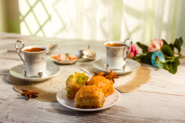 istock Two cups of Turkish coffee and a plate with baklava 853434666