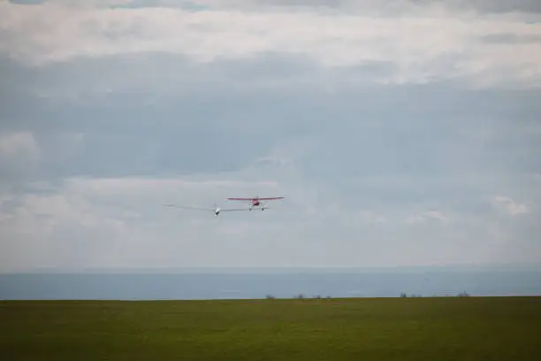 Sailplane and a towing aircraft starting on an airfield England