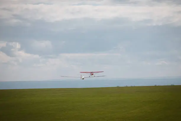 Sailplane and a towing aircraft starting on an airfield England