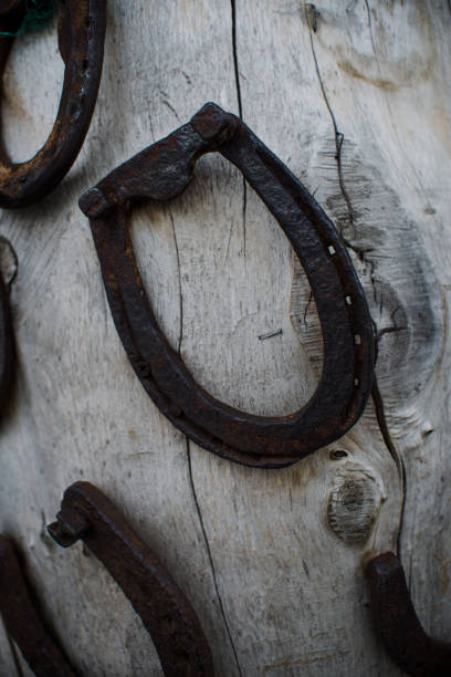istock Inside an old vintage blacksmith and workshop, close up on horseshoes 853453616