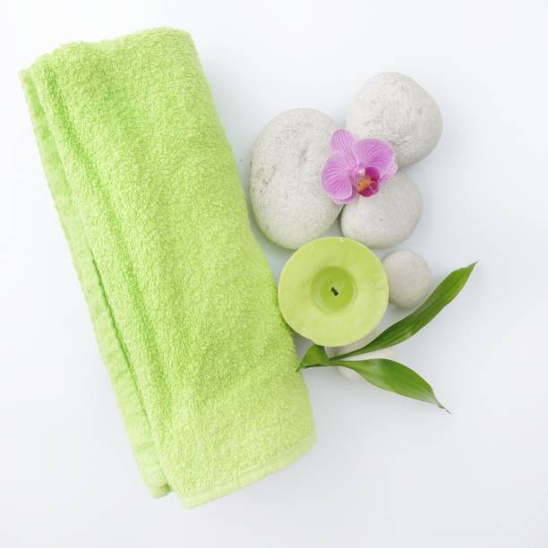 istock white zen stones and green bamboo isolated on white background 853457556