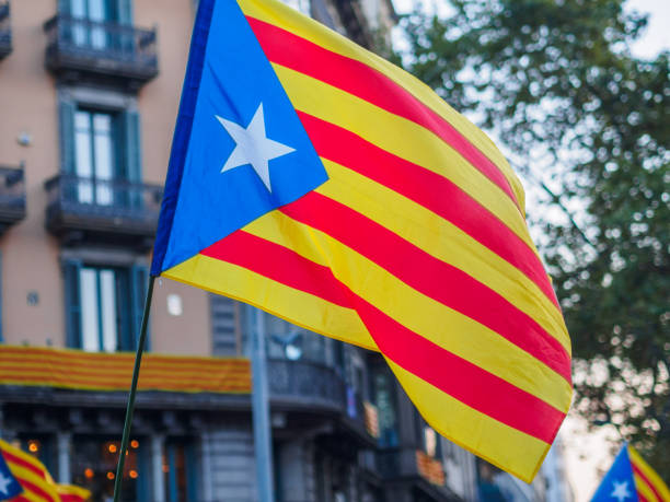 istock Catalan independence flag waving into the wind during a demonstration in the streets of Barcelona 853460950