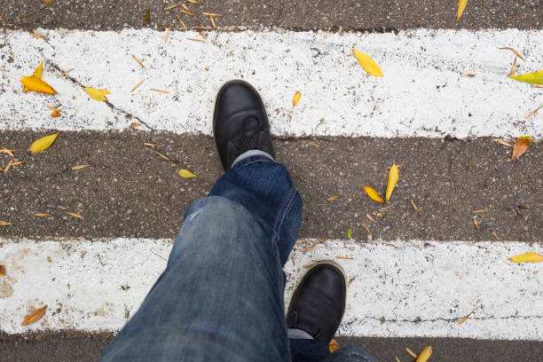 Crossing pedestrian crosswalk. Personal perspective.