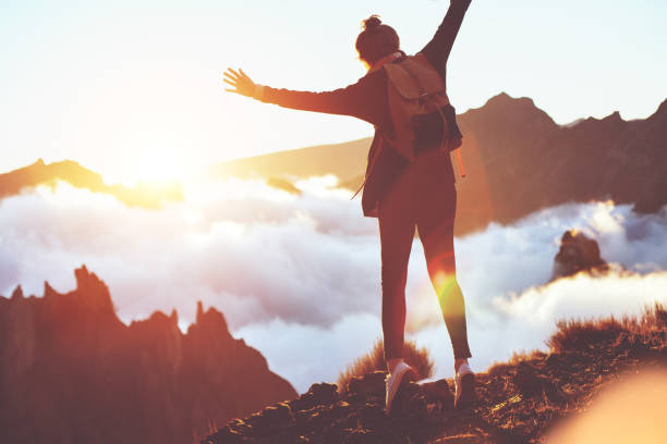 istock Woman hipster fooling around high in mountains 853461870