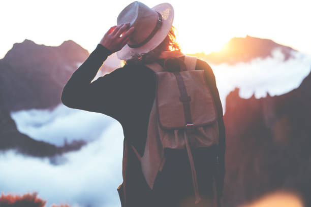 istock Woman hipster with straw hat hiking high in mountains 853467242