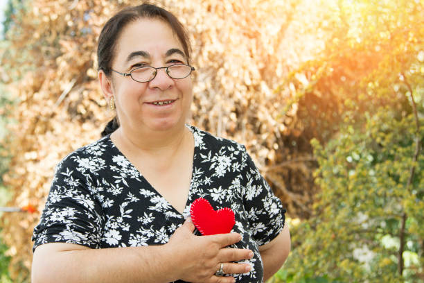 istock Senior woman holding a heart 853473546