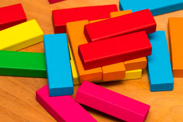 istock Scattered heap of toy colored wooden bricks 853479014