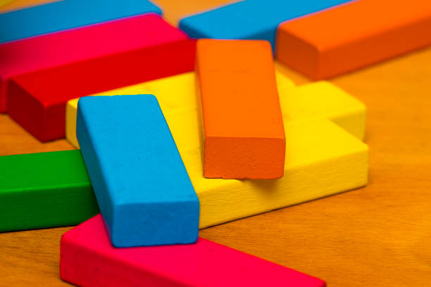 istock Scattered heap of toy colored wooden bricks 853479044